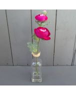 Artificial Cerise Ranunculus in a Glass Bottle