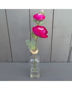 Artificial Cerise Ranunculus in a Glass Bottle
